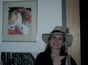 Karen with her painting, 'All That You Dream' at the ArtRocksAthens opening